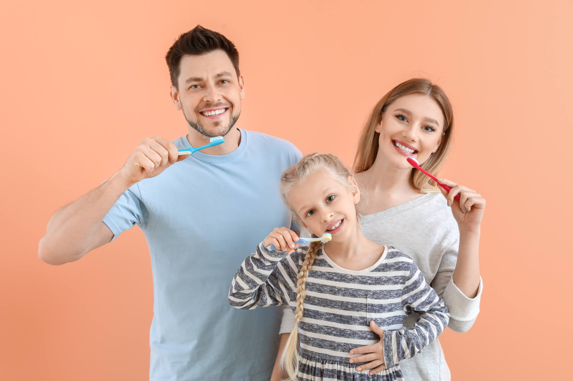 family brushes teeth together family dentistry in Simpsonville, SC