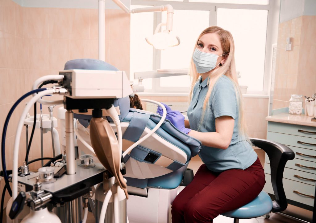 dentist monitoring patient under sedation dentistry in Simpsonville SC