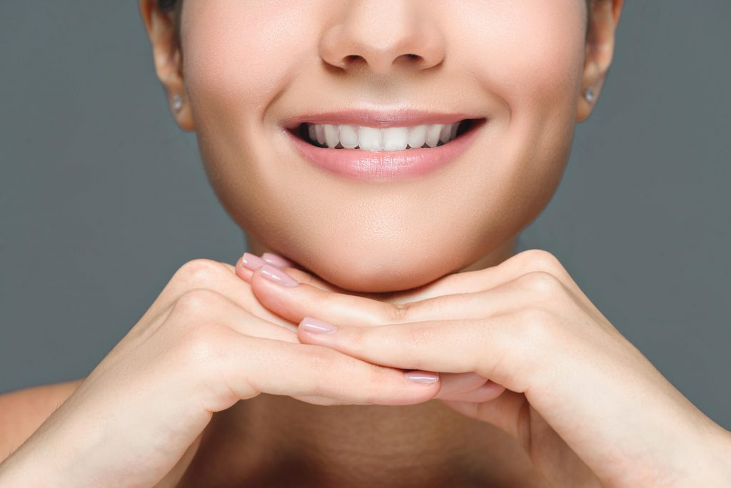 woman shows teeth whitening in Simpsonville, SC