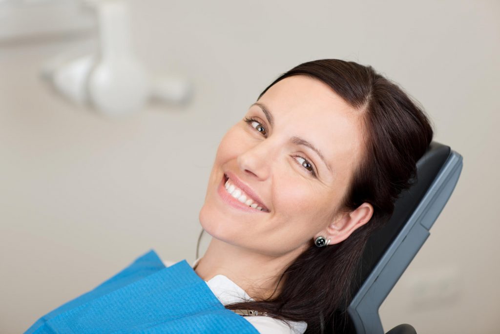 woman getting dental implants in Simpsonville SC