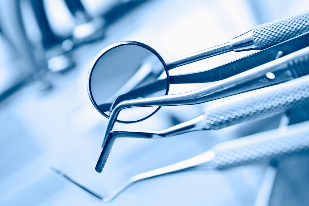 crowns in Simpsonville SC on the dental table with other instruments