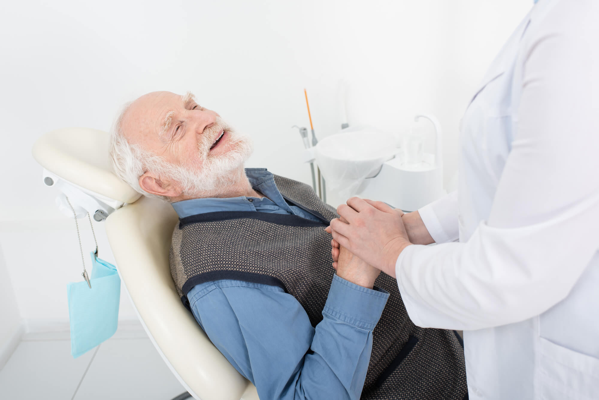 an expert in Family Dentistry in Greenville SC with a senior patient