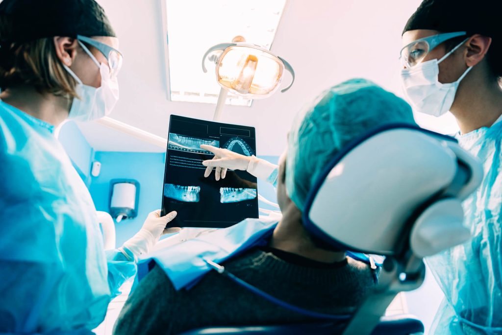an expert in Oral Surgery in Greenville SC explaining an x-ray result