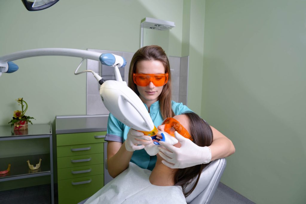 dentist and patient during teeth whitening in Greenville SC