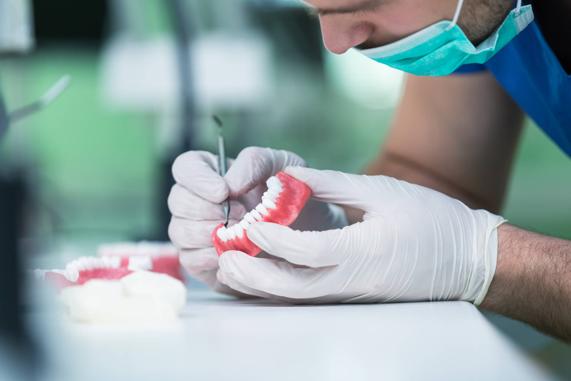 dentist working on dentures in Greenville SC