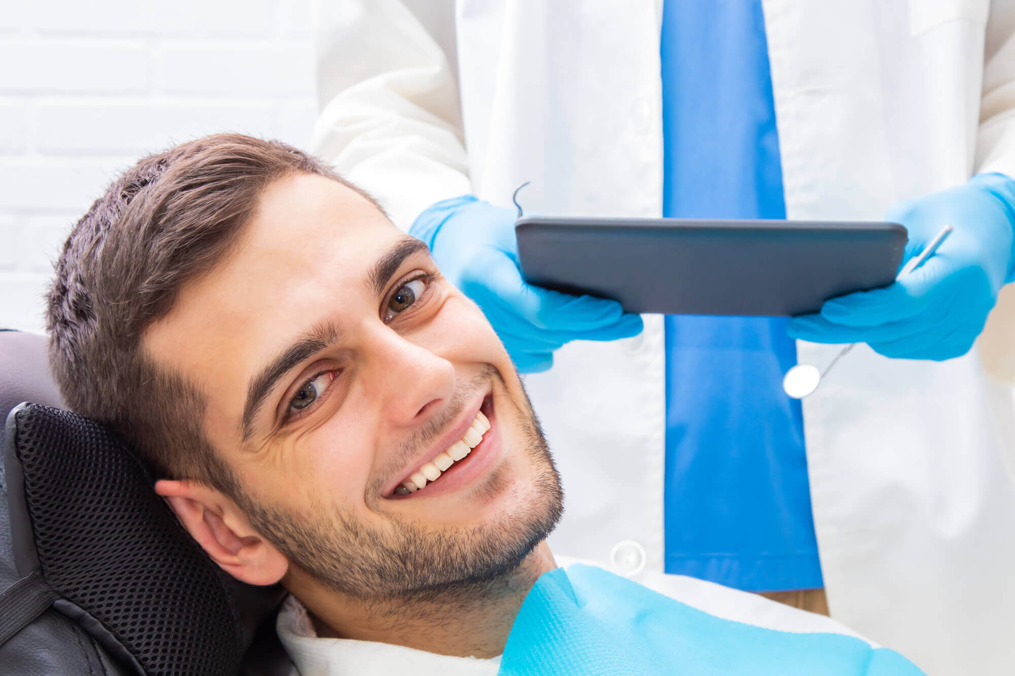 A man smiling after getting dental implants in Simpsonville SC.