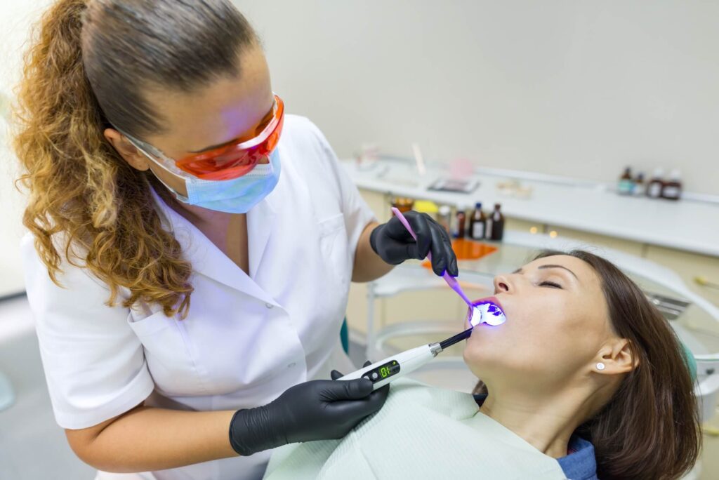 dentist performing dental treatment after administering sedation dentistry in Simpsonville SC